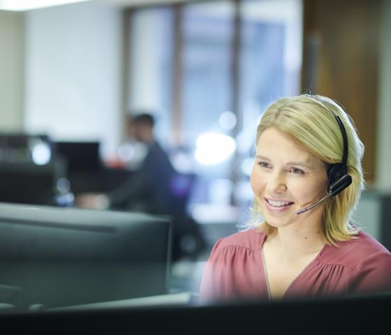 Woman with headphone answering call